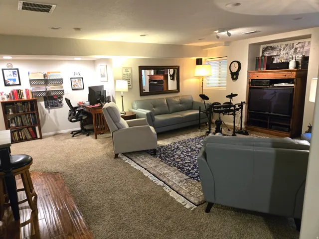 Recessed lighting, track lighting, and a built-in media cabinet