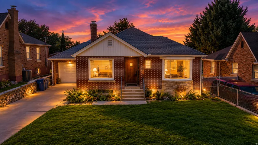 Brick exterior with stone accents and a bay window