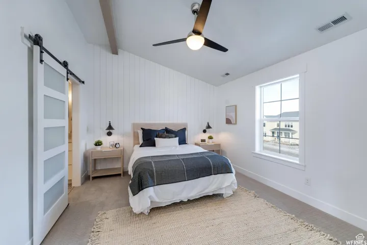 Vaulted ceiling with exposed wood beam
