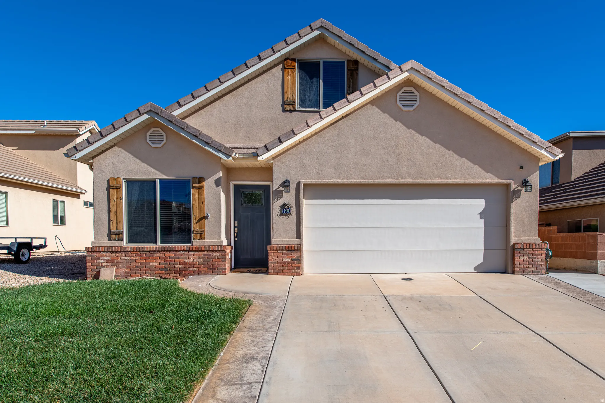 Stucco exterior with a tiled roof