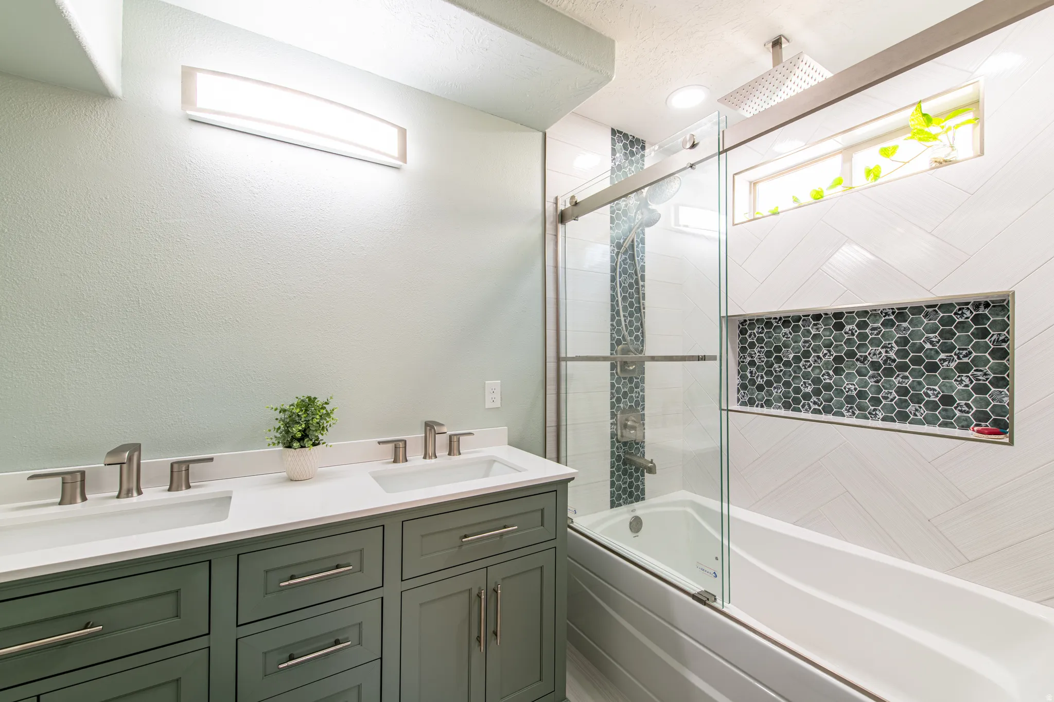 Dual vanity with integrated sinks and brushed nickel fixtures
