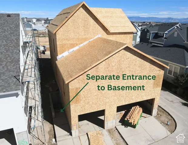 Exterior of Actual Home Progress- Under construction featuring a separate basement entrance