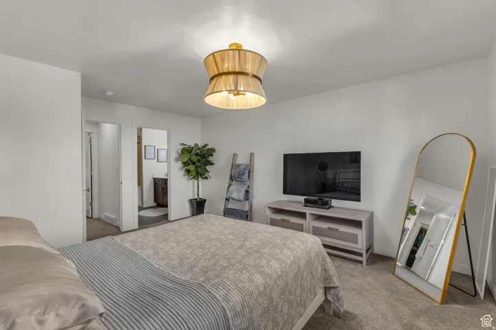 Recessed lighting, ceiling-mounted fixture, soft carpeting, and painted interior walls
