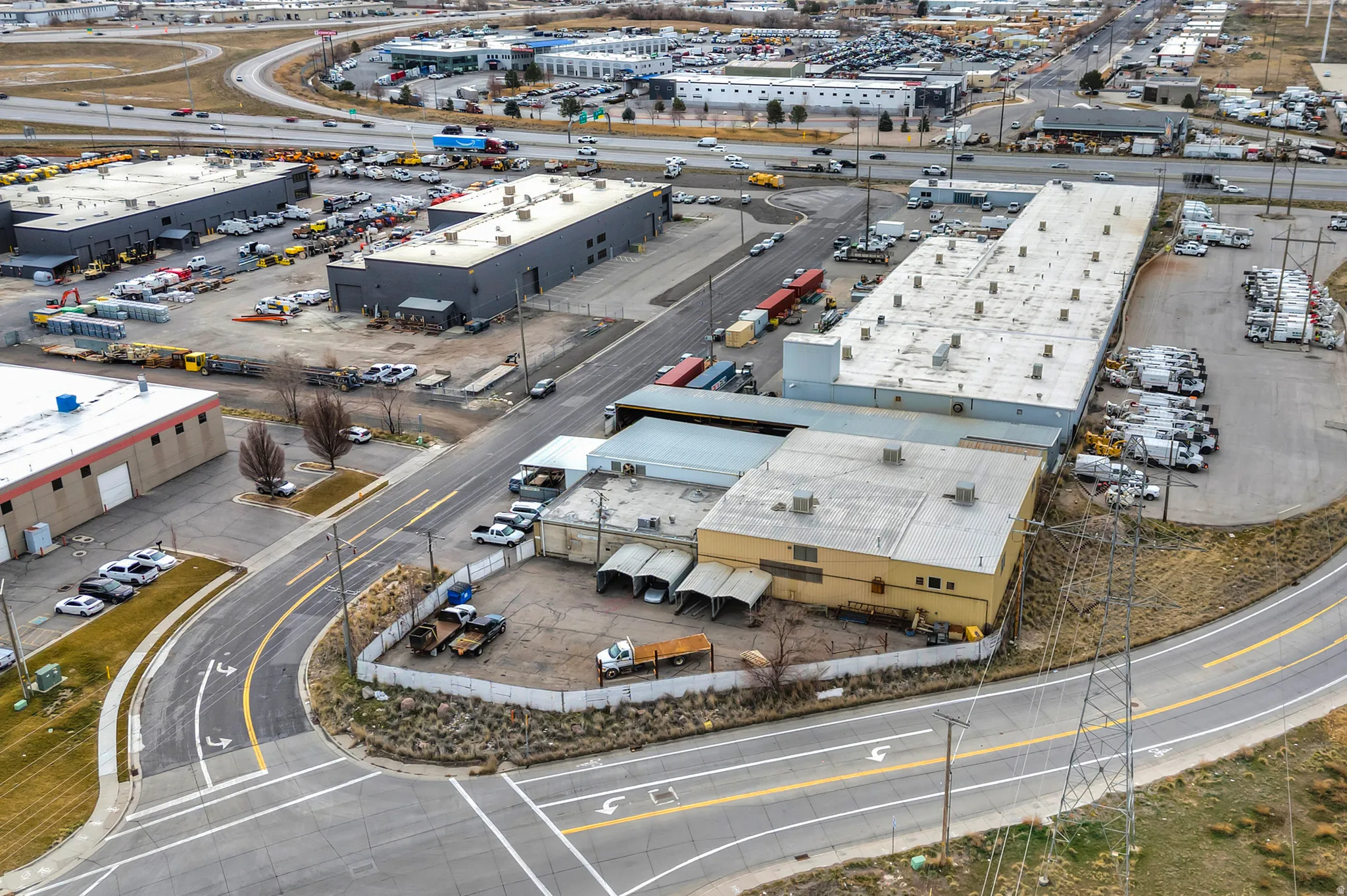 Industrial building with extensive surface parking and multiple access roads