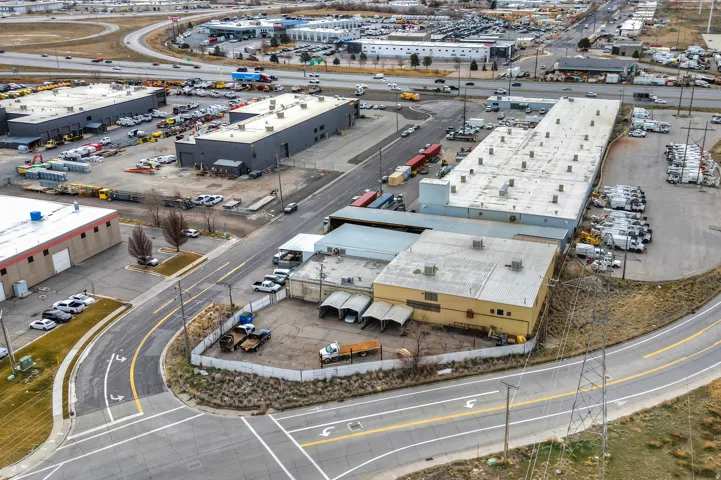 Industrial building with extensive surface parking and multiple access roads