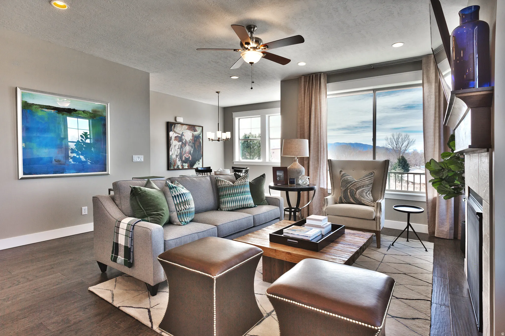 Hardwood-finish flooring throughout, recessed lighting, and a ceiling fan with integrated lighting