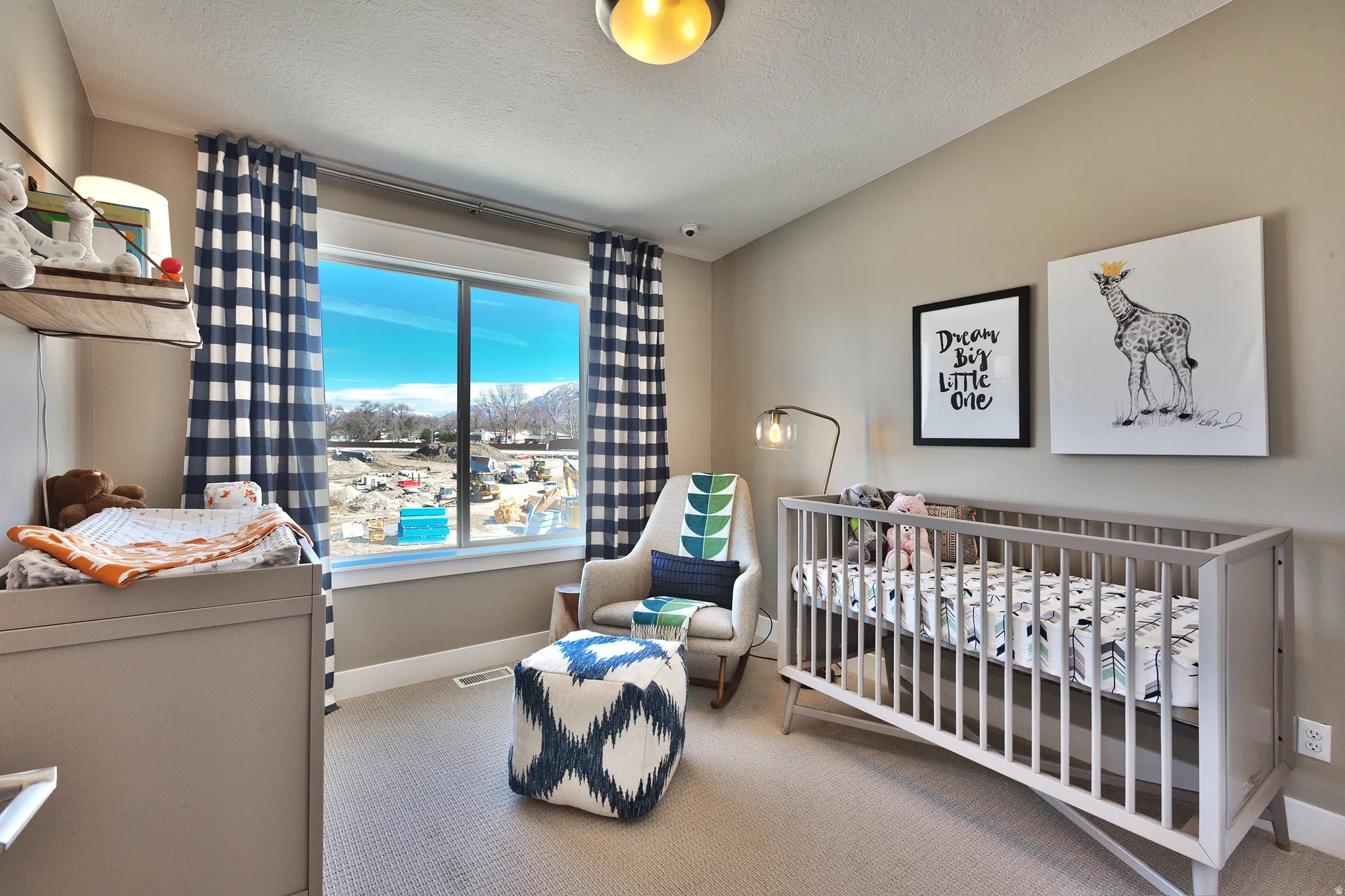 Broad window with a wide sill, neutral wall color, and carpeted flooring