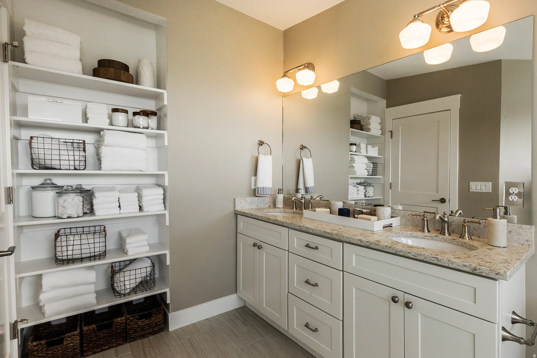 Primary Bath, Double vanity with undermount sinks, stone countertops, and brushed nickel fixtures