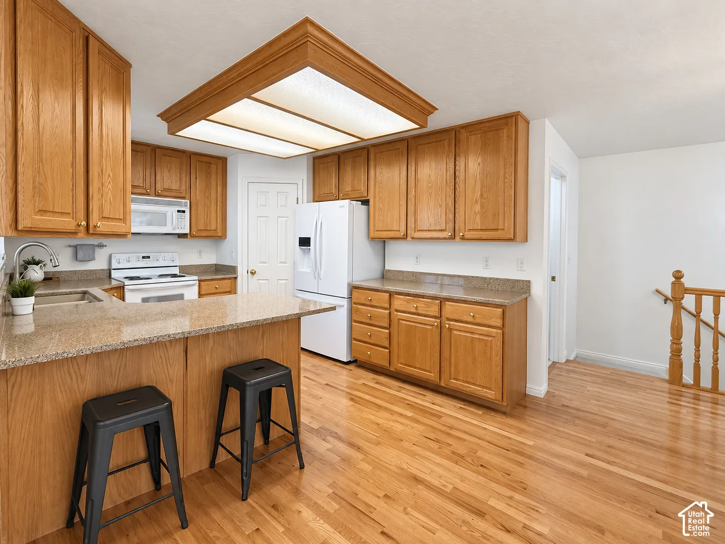 Wood-finish flooring throughout the kitchen and dining areas