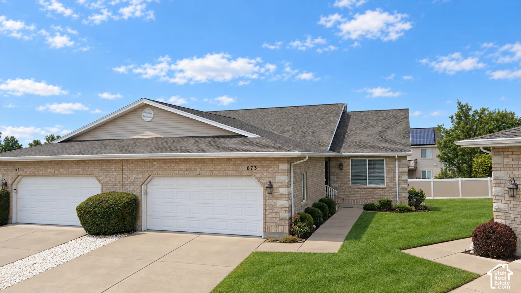 Brick and siding exterior with a shingle roof
