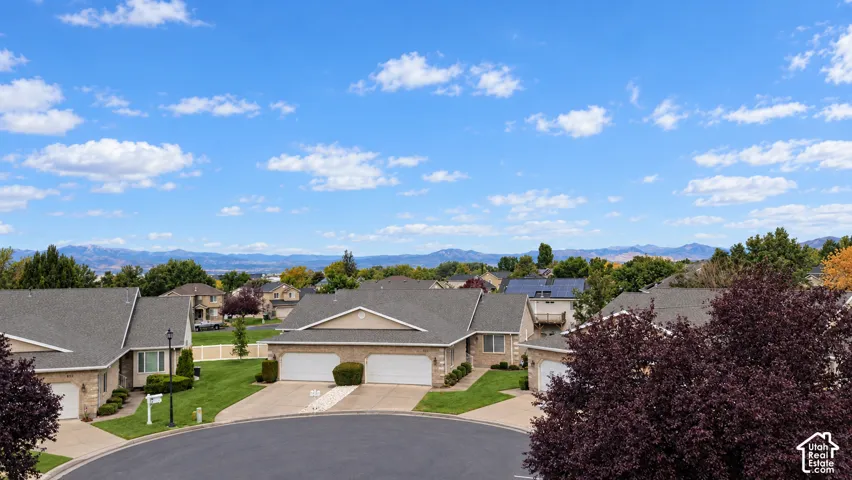 Cul-de-sac location with a brick exterior, two-car garage, and established landscaping