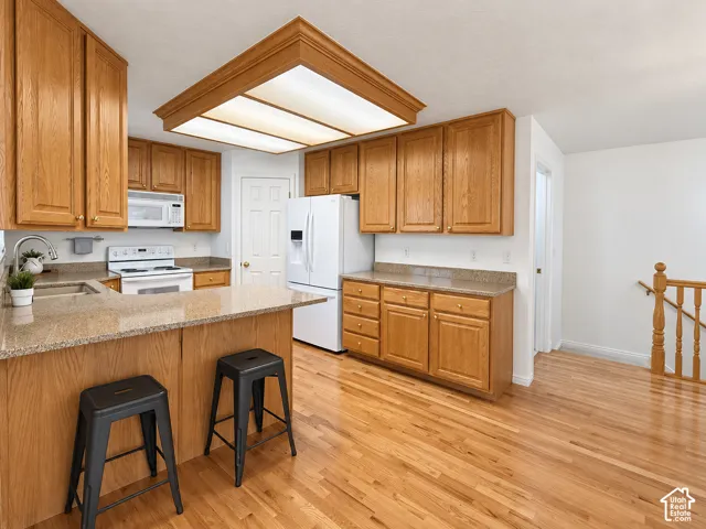 Wood-finish flooring throughout the kitchen and dining areas