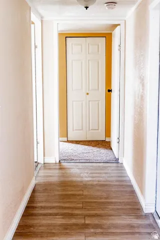 Wood-finish flooring throughout the hallway