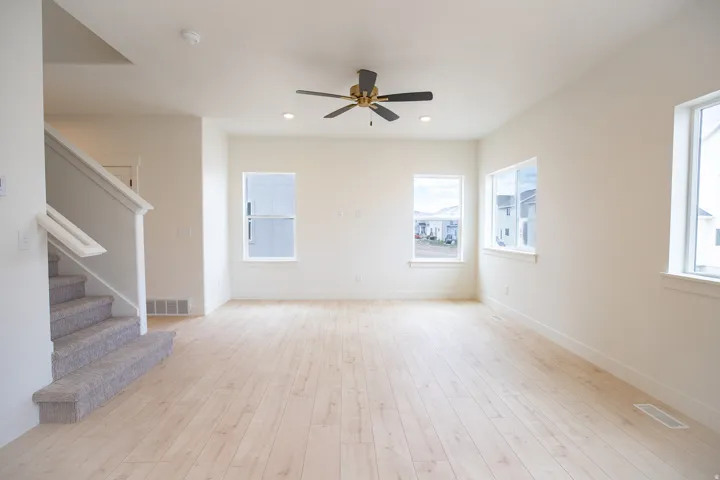 Family room with recessed lighting and a ceiling fan