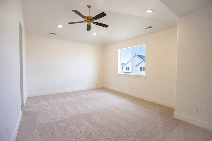 Large primary bedroom with vaulted ceilings
