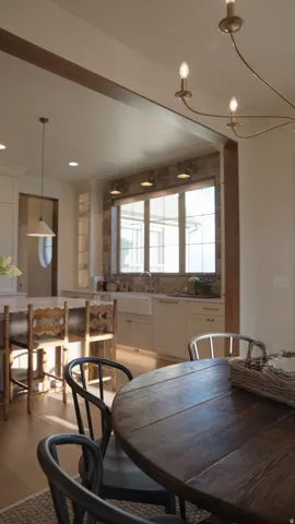 Wood-finish flooring, exposed wood beams, and a farmhouse sink