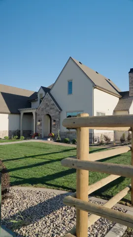Stucco and stone exterior with gabled roof lines