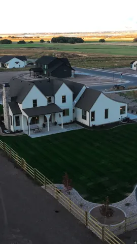 Contemporary farmhouse architecture with multiple gables and a covered patio