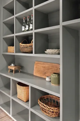 Built-in shelving unit with multiple cubbies and a smooth, painted finish