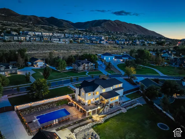 Expansive property with a private swimming pool, multi-level deck, and integrated landscaping