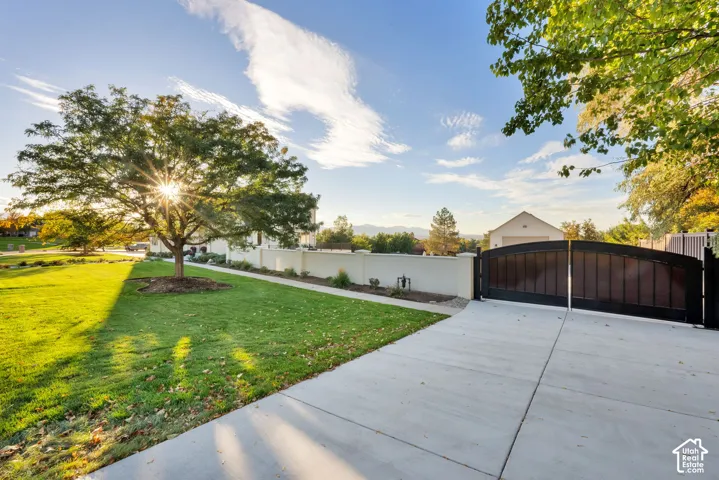 Second driveway with Private gated entry with a concrete drive to detached garage.