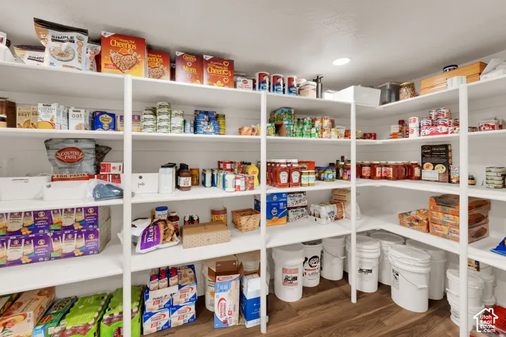 Custom-built corner shelving providing extensive storage