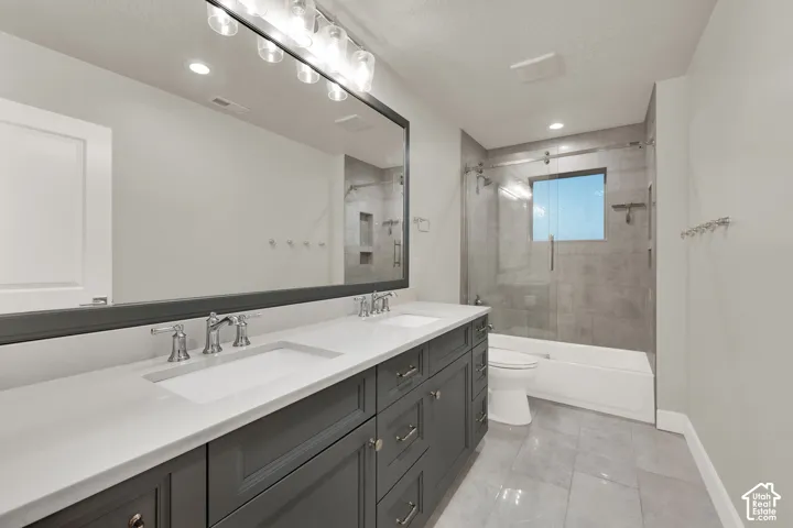 Bathroom 2 upstairs.  Dual vanity with a white countertop and undermount sinks