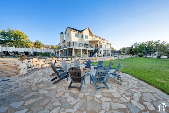 Expansive flagstone patio with a built-in fire pit
