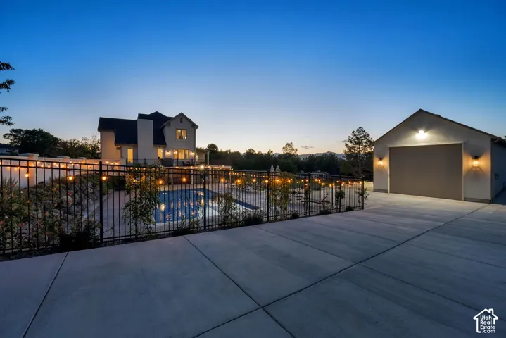 Expansive concrete driveway and detached garage