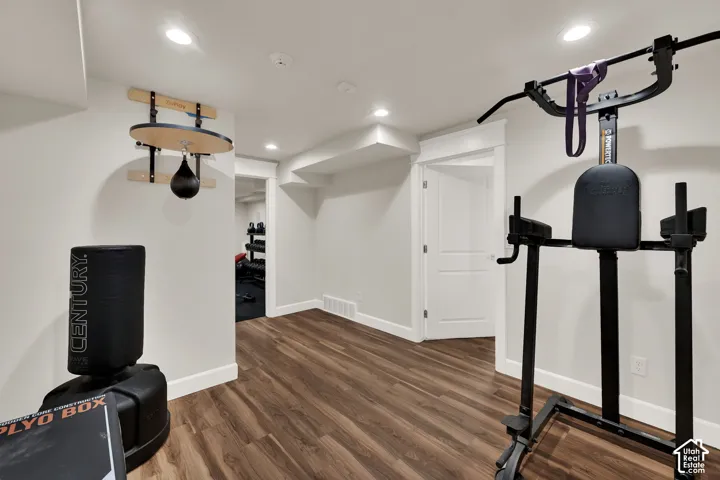 Recessed lighting illuminating wood-finish flooring