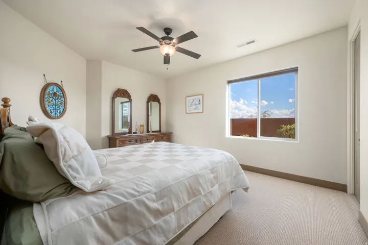 Carpeted flooring, recessed window, and ceiling fan with integrated lighting