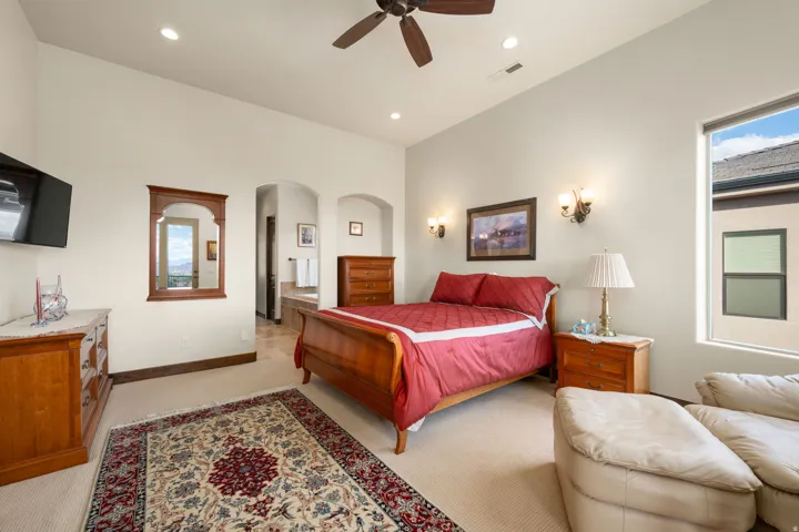 Primary Bedroom. High ceilings with recessed lighting and a ceiling fan