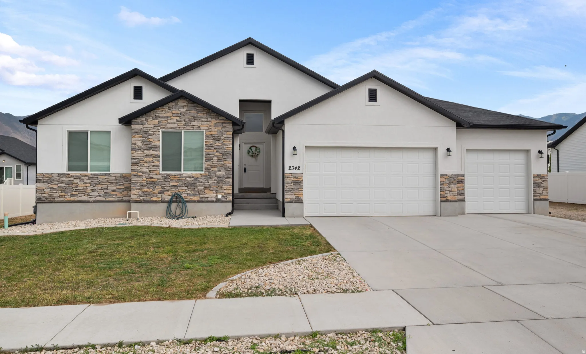 Stucco exterior with stone veneer accents