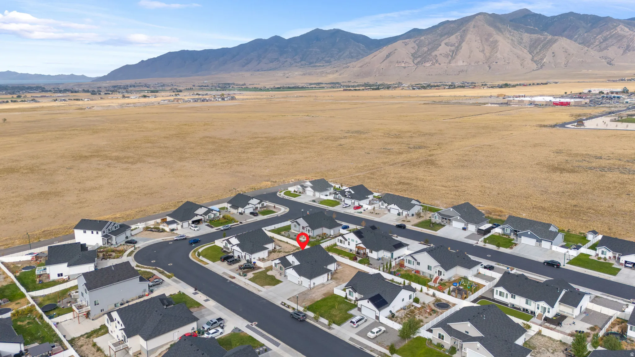 Residential community with paved streets and uniform housing styles