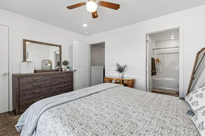 White walls with recessed lighting and a ceiling fan