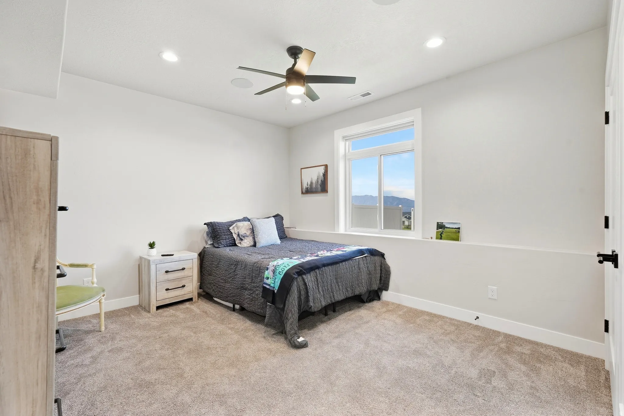 Recessed lighting, ceiling fan, and carpeted flooring