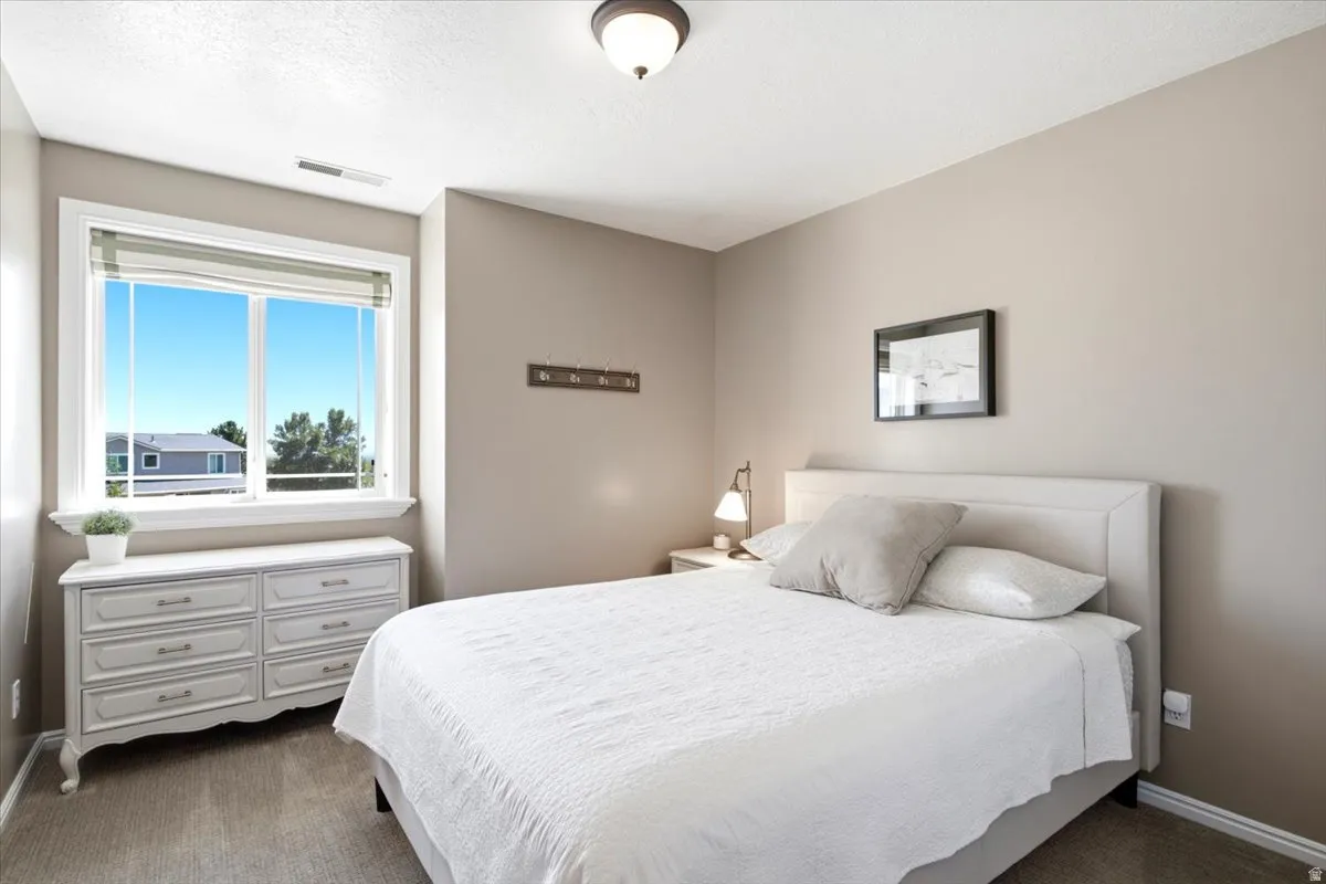 Recessed window with white trim, light-toned wall paint, and overhead flush-mount lighting