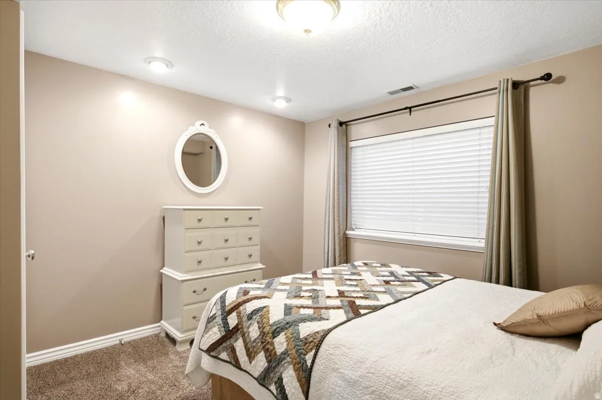 Recessed ceiling lighting, flush mount ceiling fixture, and a window with blinds and drapes