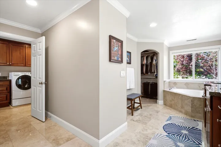 Large format tile flooring extending through the space