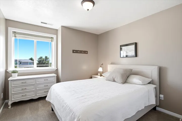 Recessed window with white trim, light-toned wall paint, and overhead flush-mount lighting