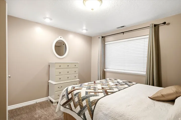 Recessed ceiling lighting, flush mount ceiling fixture, and a window with blinds and drapes