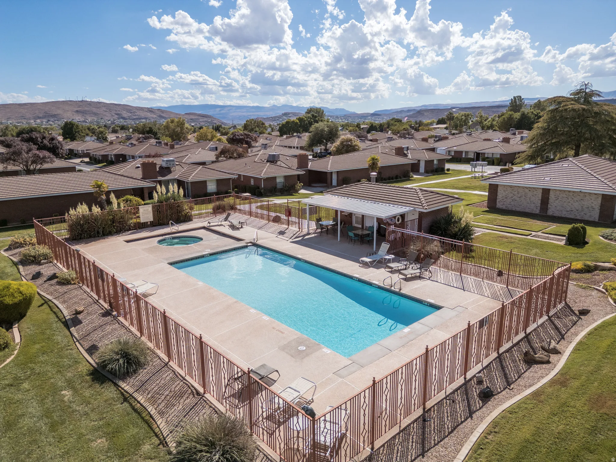Community swimming pool with an integrated spa