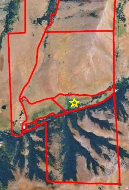 Survey Map. Outlining the boundaries of the property and indicating a specific point of interest with a star symbol