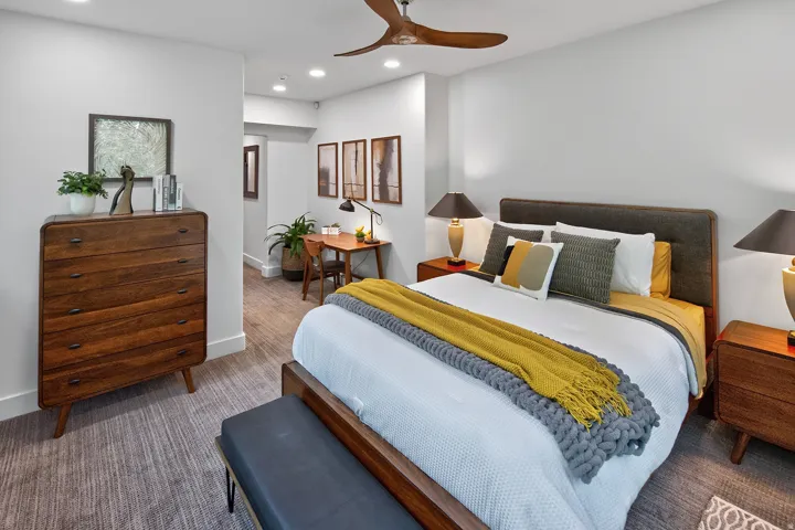 Recessed lighting throughout, wood-finish flooring, and a ceiling fan with wood-finish blades