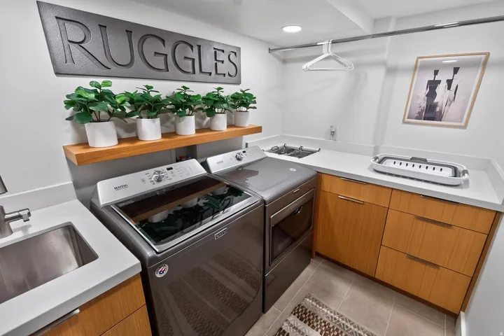 Integrated laundry appliances with dual stainless steel utility sinks