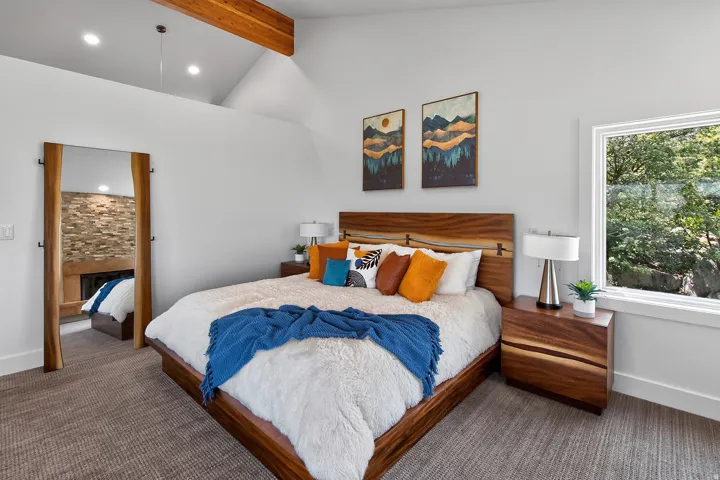 Vaulted ceiling with exposed wood beam and recessed lighting
