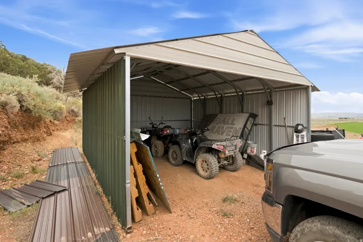 Metal carport structure with a gabled roof
