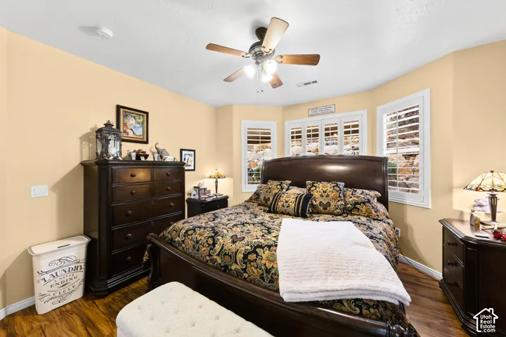 Wood-finish flooring with a ceiling fan light fixture