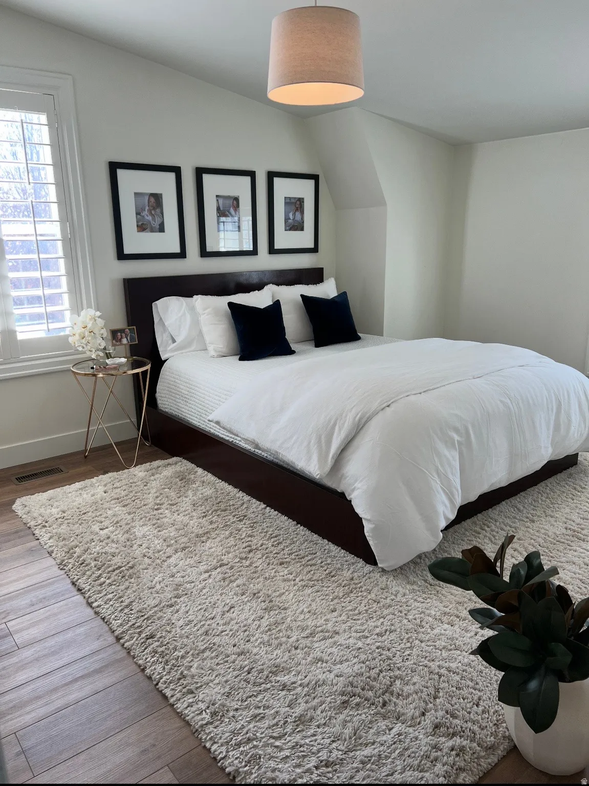 Wood-finish flooring with a drum pendant light fixture