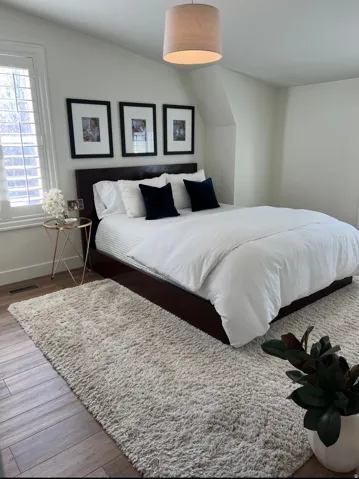 Wood-finish flooring with a drum pendant light fixture